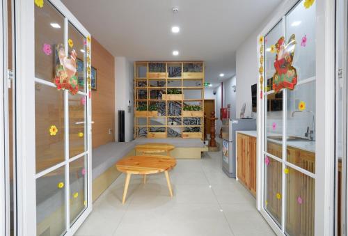 a kitchen with a table and a bench in a room at Babylon D3 Serviced Apartment in Ho Chi Minh City