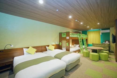 Postel nebo postele na pokoji v ubytování La'gent Hotel Tokyo Bay