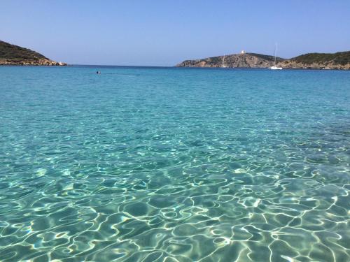 a large body of water with a boat in it at Villa Elisabetta Apartments in Pula