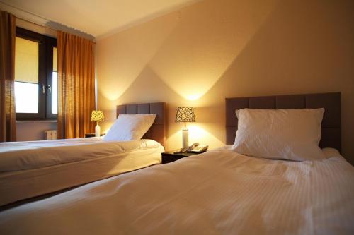Katil atau katil-katil dalam bilik di Inter Hotel