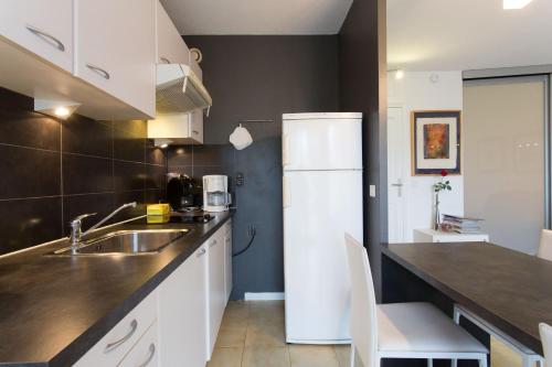 Kuchyň nebo kuchyňský kout v ubytování Rana's flat