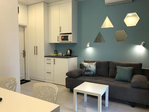 a living room with a couch and a table at Partner Guest House Baseina in Kyiv