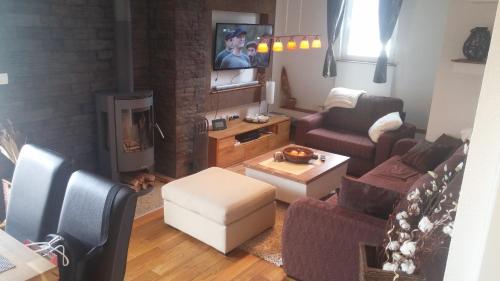 an aerial view of a living room with a fireplace at Apartman Ena in Vlasic