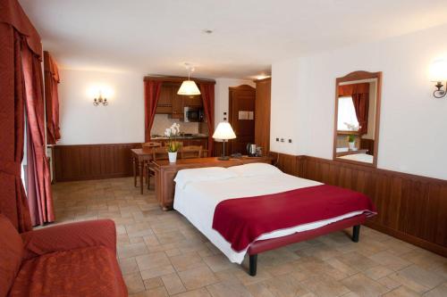 Postel nebo postele na pokoji v ubytování Residence Le Grand Chalet