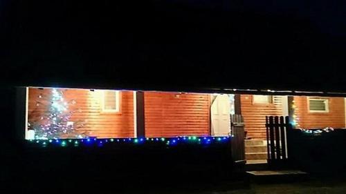 a house lit up at night with blue lights at House Luna in Rakovica