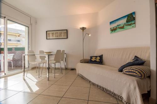 a living room with a couch and a table at Calafell Apartment 4 in Calafell