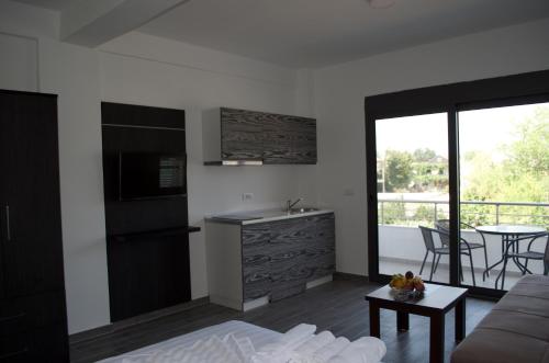 Kuchyň nebo kuchyňský kout v ubytování Flo Apartments