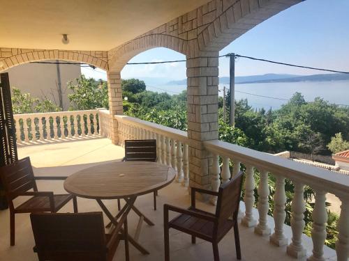 a table and chairs on a balcony with a view at Lux dodo in Dramalj