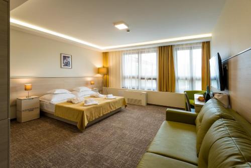 Postel nebo postele na pokoji v ubytování Hotel Kamilla