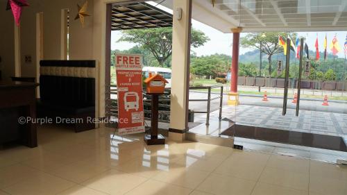 a lobby with a sign in the middle of a building at AFamosa Purple Dream Residence Condotel homestay in Melaka
