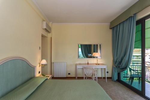 Postel nebo postele na pokoji v ubytování Hotel Siesta