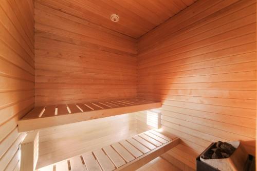 a wooden sauna with a bench in it at Tallinn City Apartments Old Town Toompea in Tallinn