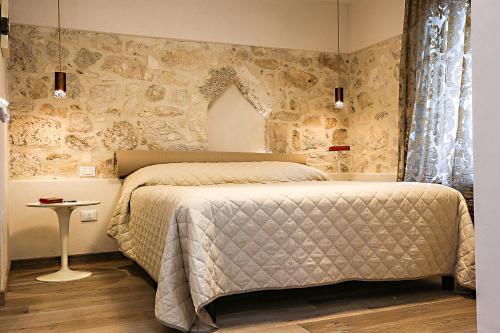 Katil atau katil-katil dalam bilik di B&B Dei Raselli