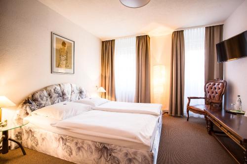 Ένα ή περισσότερα κρεβάτια σε δωμάτιο στο Hotel Wagner Am Marktplatz