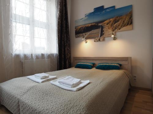 Posteľ alebo postele v izbe v ubytovaní Grand-Tourist Amber Rose Apartment