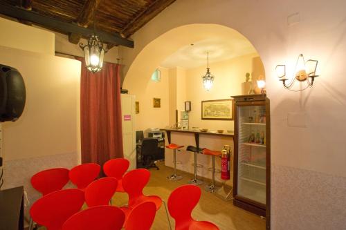 a group of red chairs in a room at Hotel Toledo in Naples