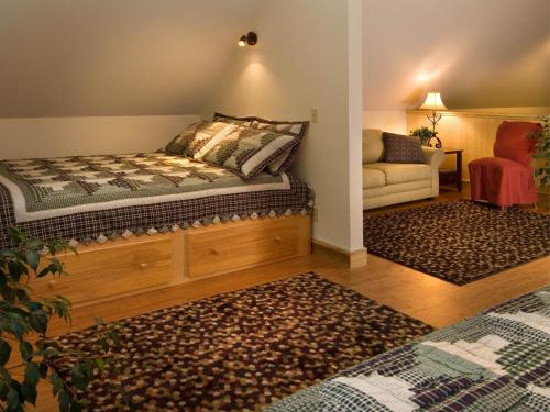 a living room with a bed and a couch at Adventures on the Gorge in Fayetteville