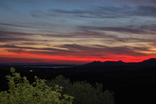 a sunset in the mountains with a red sky at B&B Nuraximannu in Santadi
