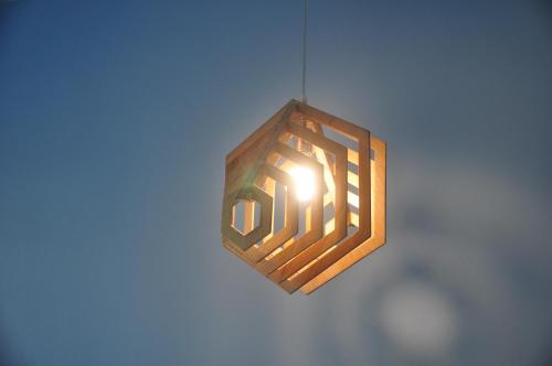 a light is hanging from a wall at Kiri Tawan in Baan Tai
