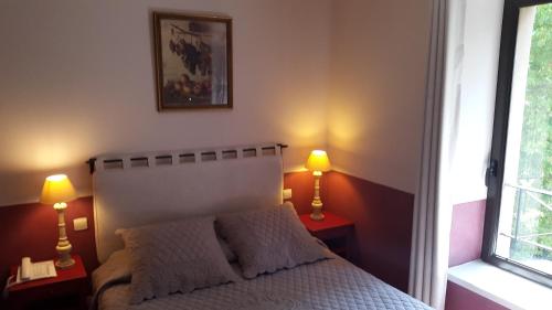 Postel nebo postele na pokoji v ubytování Hotel du Poète