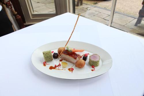 a plate of food on a white table at The White Hart in Great Yeldham