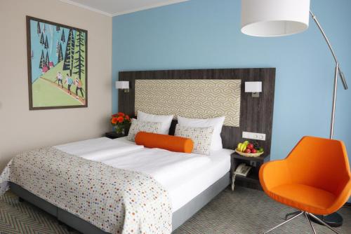 Postel nebo postele na pokoji v ubytování Trans World Hotel Auefeld