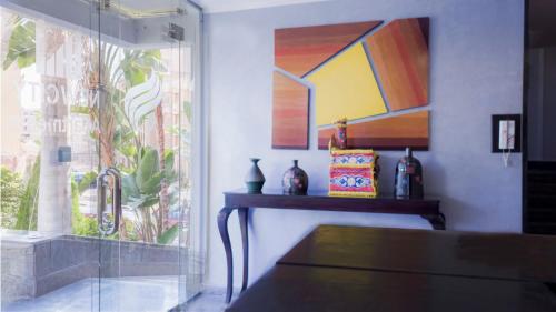 a living room with a window and a table at NewCity Hotel & Suites in Cairo