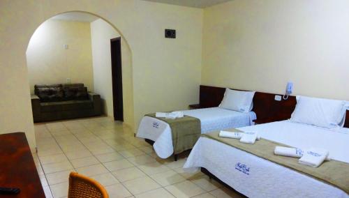 Un pat sau paturi într-o cameră la Hotel Monte Carlo Uberaba - Próximo ao Hospital UFTM , Hospital Dr Hélio Angotti e Hospital Regional Uberaba