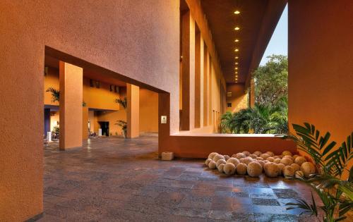a lobby of a building with a bunch of balls on the floor at Las Brisas Ixtapa in Ixtapa