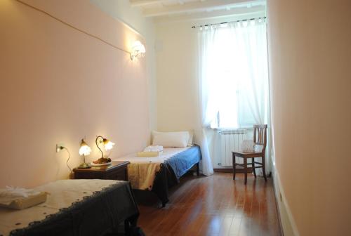 Llit o llits en una habitació de Dreaming Navona Rooms