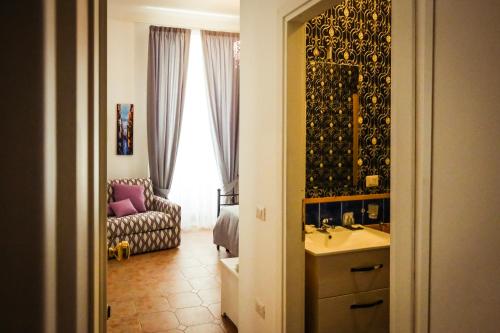 Postel nebo postele na pokoji v ubytování NapoliMia Boutique Hotel