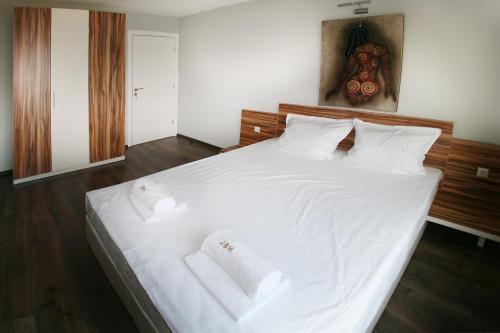 Postel nebo postele na pokoji v ubytování JBH Hotel