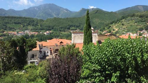 a town in a valley with mountains in the background at Farfalle E Gabbiani in Tramonti