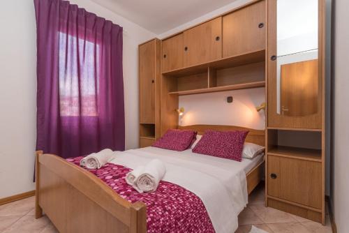 Ένα ή περισσότερα κρεβάτια σε δωμάτιο στο Apartments Vojin