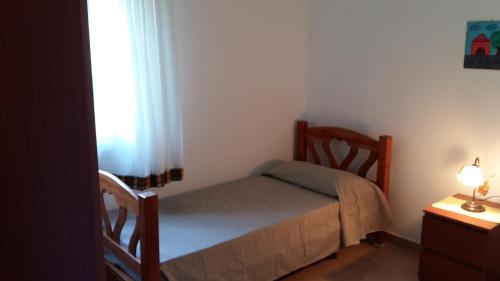 Ein Bett oder Betten in einem Zimmer der Unterkunft La casa di Sam
