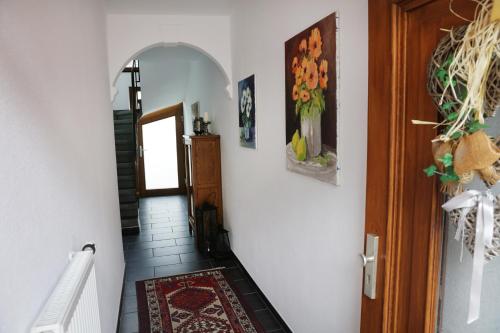 a hallway with a stairway leading to a room at Georgs Ferienhaus in Zeltingen-Rachtig
