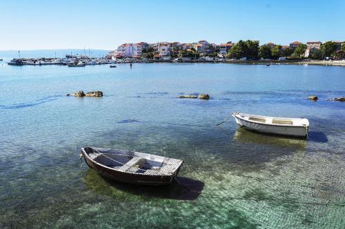 two boats are sitting in the water at Apartment Toni Relax in Split