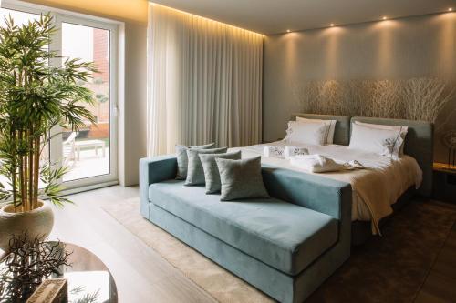 Кровать или кровати в номере Casa do Rio charm suites