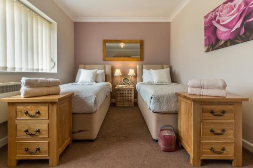 Ένα ή περισσότερα κρεβάτια σε δωμάτιο στο Harleys Court Self catering holiday cottages