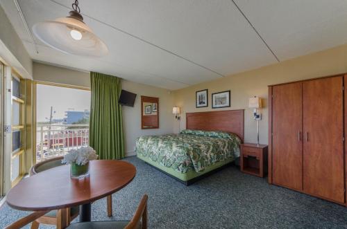 Postel nebo postele na pokoji v ubytování Attache Motel