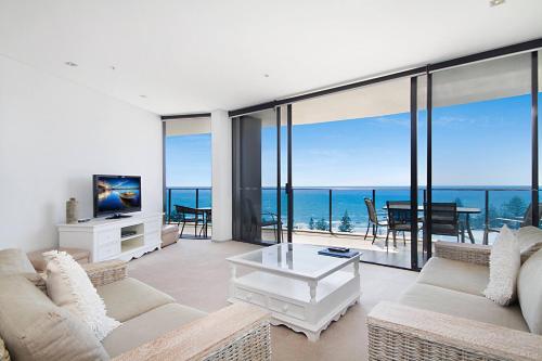 a living room with a view of the ocean at Ambience on Burleigh Beach in Gold Coast