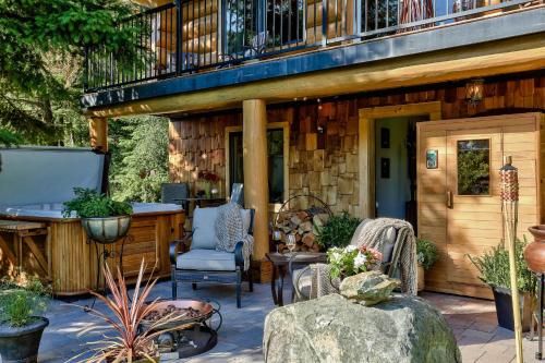a porch of a house with a deck and a balcony at A Suite Retreat - Beyond Bed & Breakfast in Sun Peaks