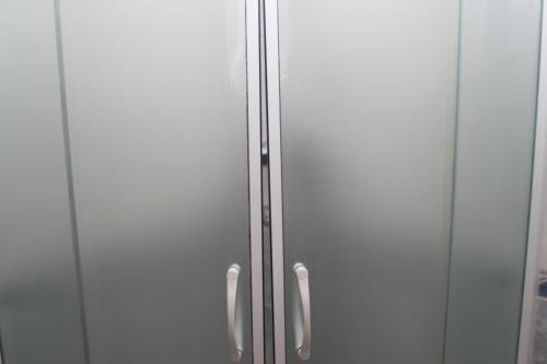 a metal cabinet with two doors in a room at Penzion V Ráji in Strakonice