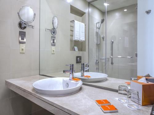 A bathroom at Centro Waha by Rotana