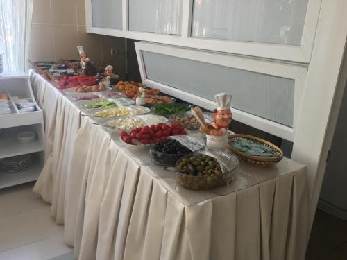 a buffet line of food on a table at Konyaaltı HOTEL in Antalya