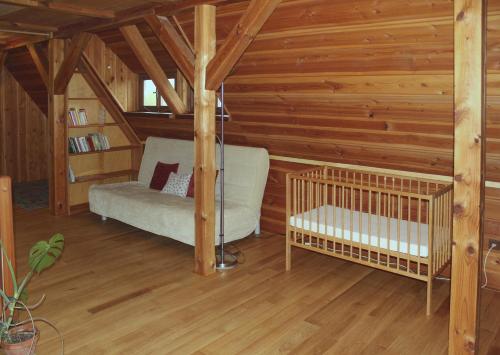Postel nebo postele na pokoji v ubytování Apartmán ve Skanzenu