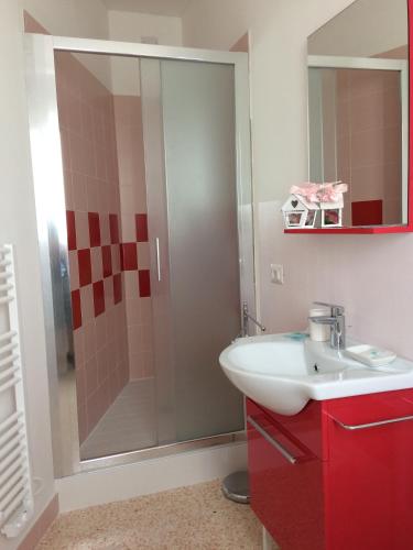 a bathroom with a sink and a shower at Joy Living in Sandra