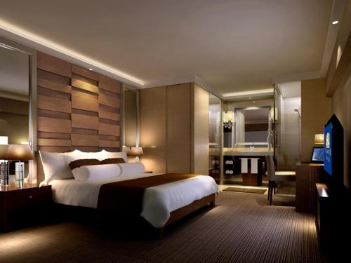 En eller flere senge i et værelse på Best Western Premier Hotel Hefei