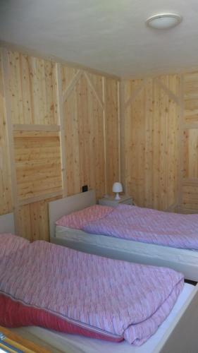 Postel nebo postele na pokoji v ubytování Appartamenti Presanella