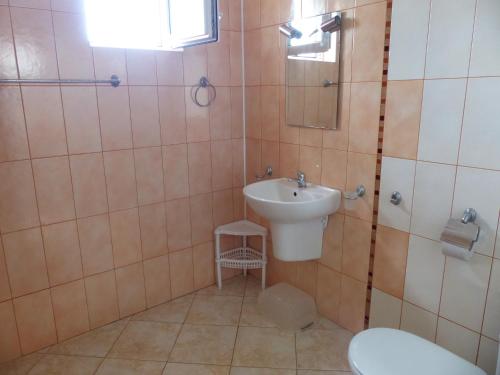 a bathroom with a sink and a toilet at Studio S - Vasiliko in Tsarevo
